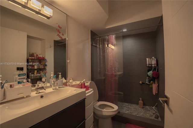 bathroom with vanity, toilet, and a shower with shower curtain