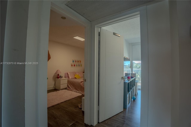 corridor with dark hardwood / wood-style floors