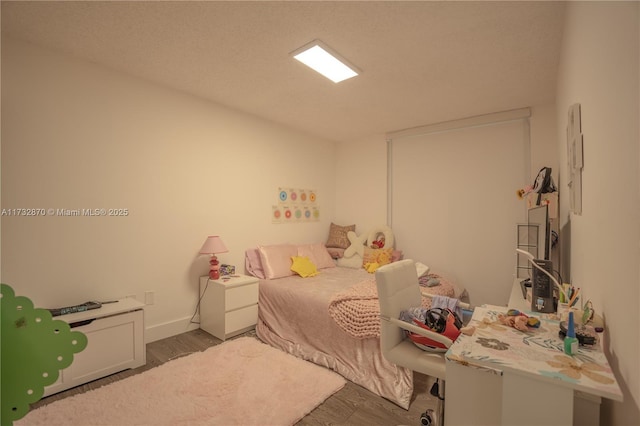 bedroom featuring dark hardwood / wood-style floors