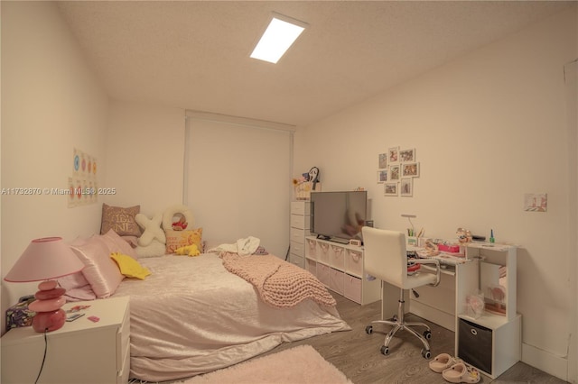 bedroom featuring hardwood / wood-style floors