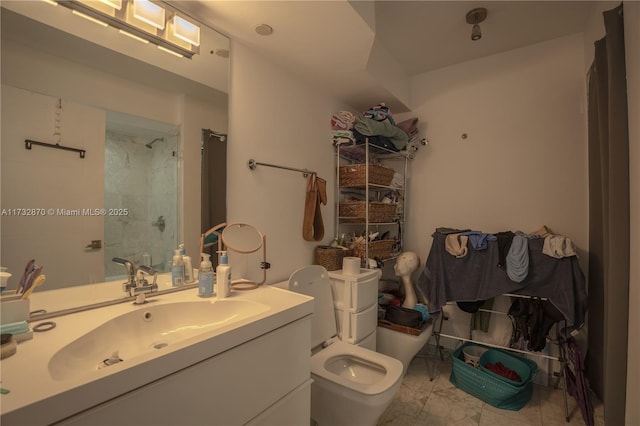 bathroom with vanity, toilet, and walk in shower