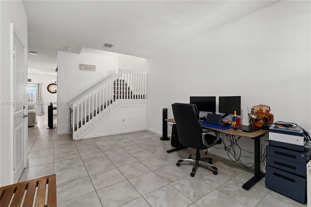 office space with light tile patterned floors