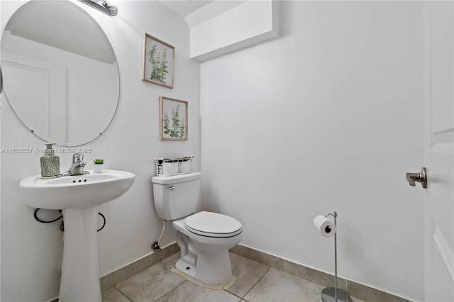 bathroom with tile patterned floors and toilet