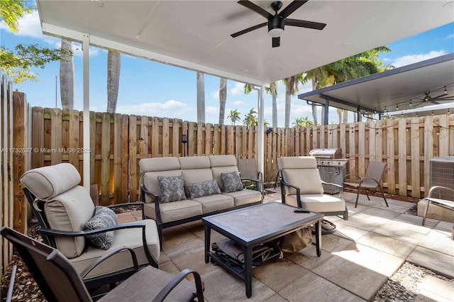 view of patio / terrace with area for grilling, cooling unit, outdoor lounge area, and ceiling fan