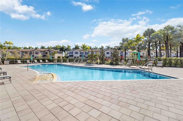 view of swimming pool with a patio