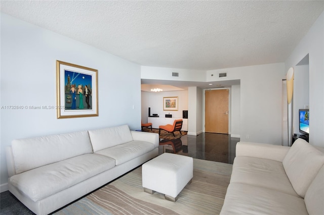 living room featuring a textured ceiling