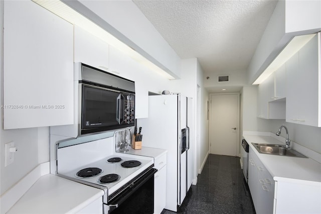 kitchen featuring range with electric stovetop, sink, white cabinets, stainless steel dishwasher, and a textured ceiling