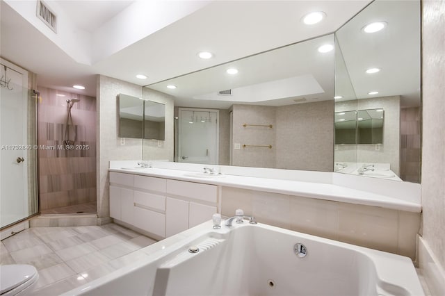 full bathroom featuring tile patterned flooring, shower with separate bathtub, vanity, and toilet