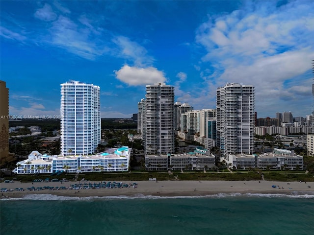 property's view of city featuring a view of the beach and a water view