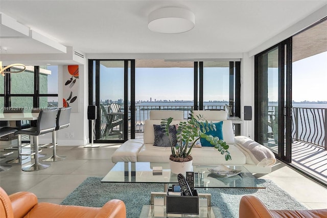 living room featuring a wealth of natural light and a wall of windows