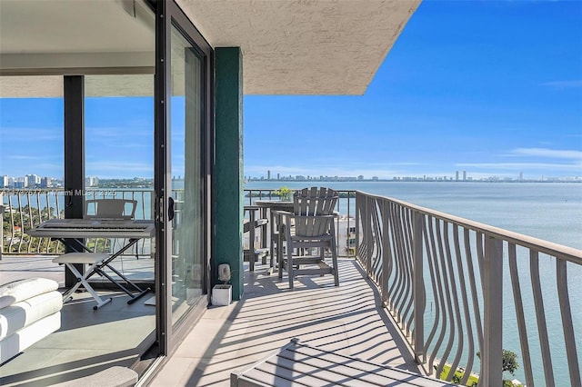 balcony featuring a water view