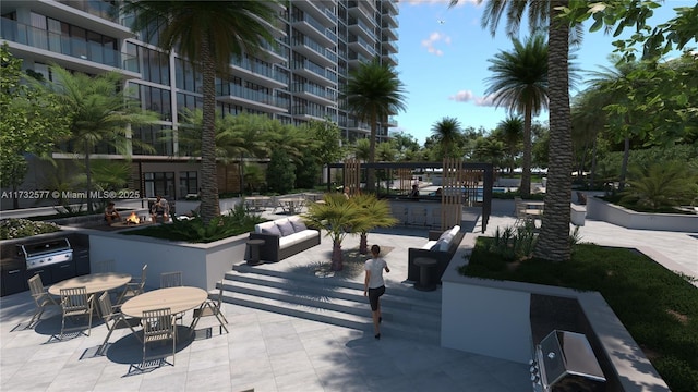 view of property's community with a patio area