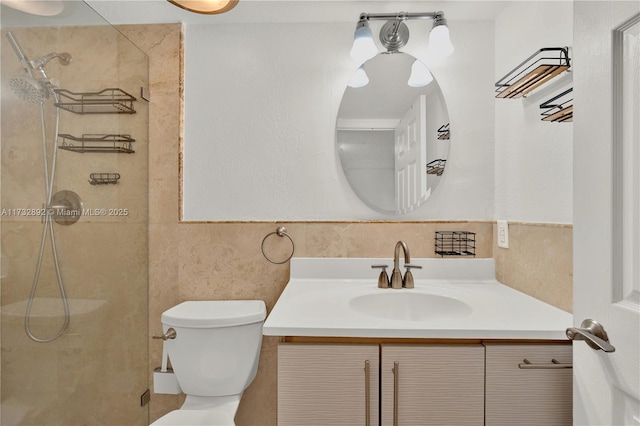 bathroom featuring vanity, a shower, and toilet