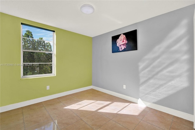 unfurnished room featuring light tile patterned floors