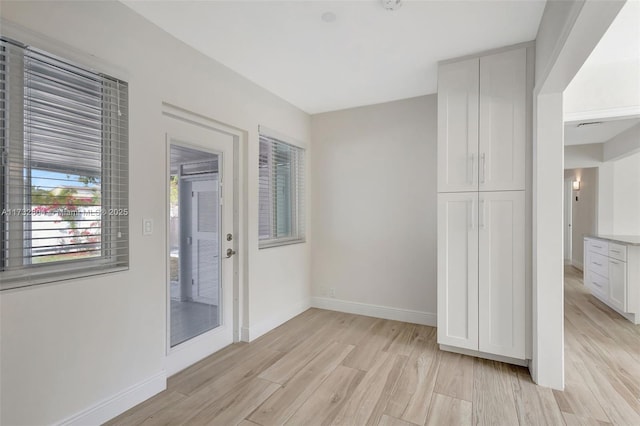 unfurnished room featuring light hardwood / wood-style floors