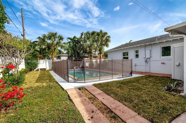 view of pool featuring a yard