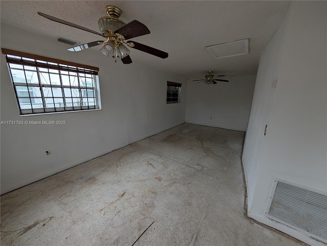 unfurnished room with ceiling fan