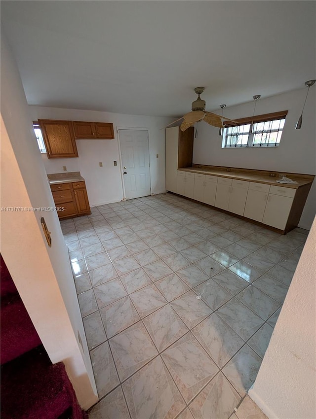 interior space featuring ceiling fan