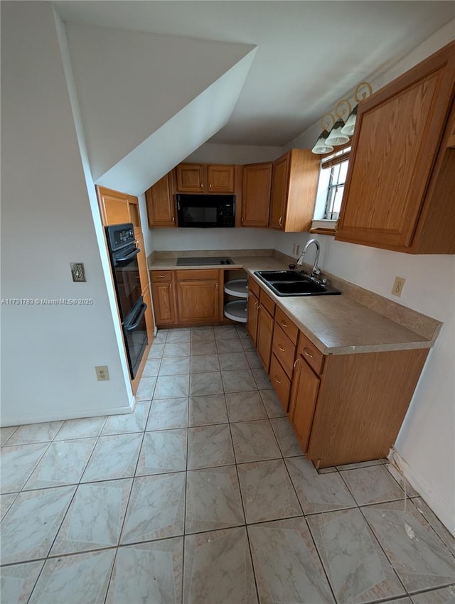 kitchen with sink, vaulted ceiling, and black appliances