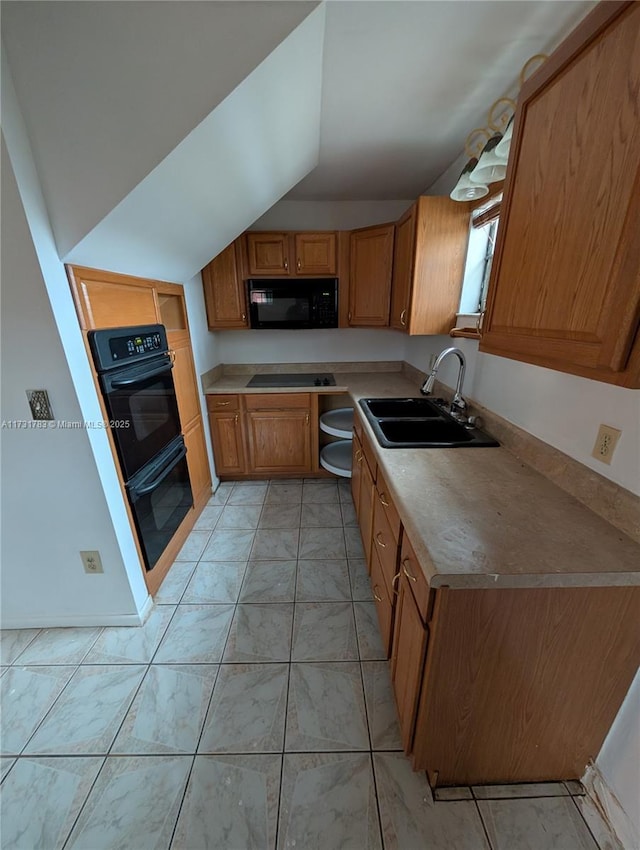 kitchen with lofted ceiling, sink, and black appliances