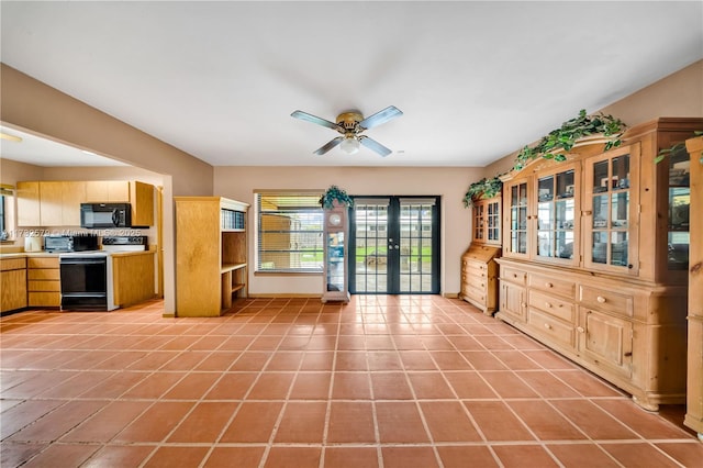 kitchen with french doors, light brown cabinets, light tile patterned floors, electric stove, and ceiling fan