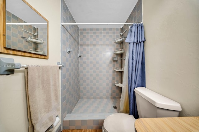 bathroom with toilet and walk in shower