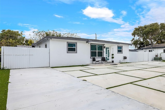 back of house featuring a patio and cooling unit