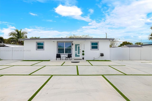 back of property with a patio area