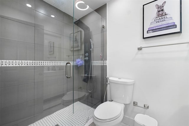 bathroom featuring toilet and walk in shower