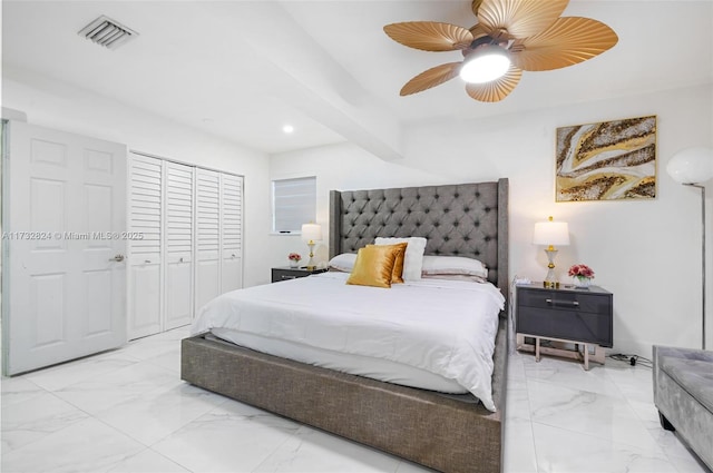 bedroom featuring beam ceiling, ceiling fan, and a closet