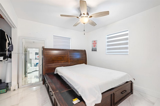 bedroom featuring ceiling fan and a closet