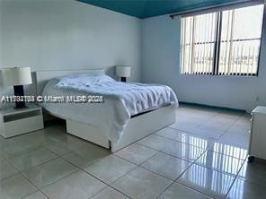 bedroom with tile patterned floors