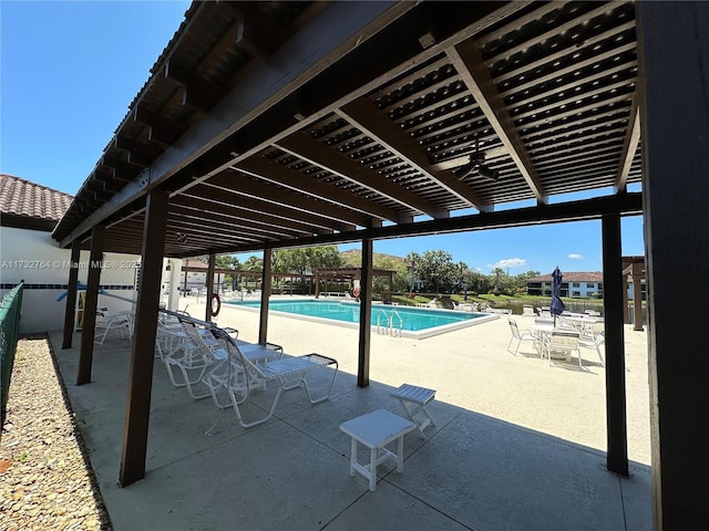 view of swimming pool with a pergola and a patio