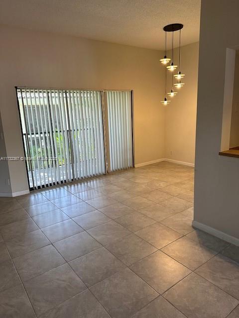 spare room with tile patterned flooring