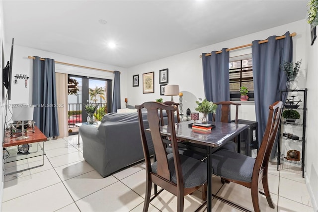 dining space featuring tile patterned flooring