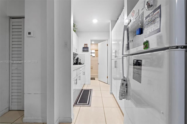 corridor with light tile patterned floors