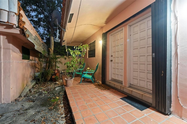 doorway to property with a patio