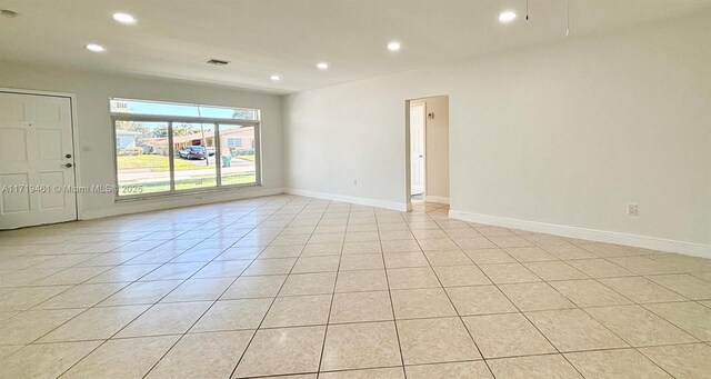 empty room with light tile patterned floors