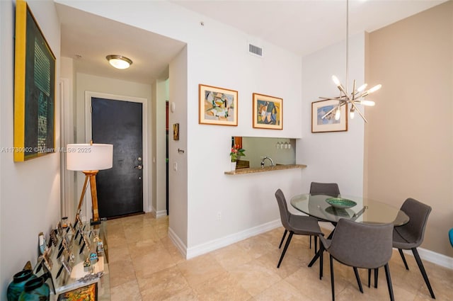 dining space featuring a chandelier