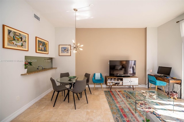 dining space with a notable chandelier