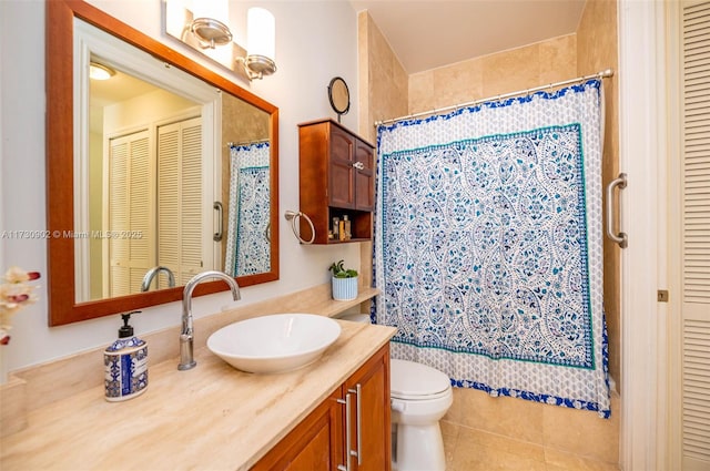 bathroom with vanity, tile patterned floors, toilet, and a shower with shower curtain