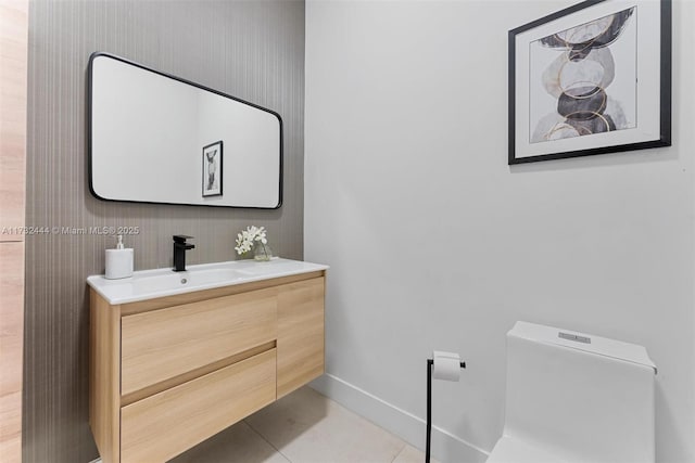 bathroom with vanity, tile patterned floors, and toilet