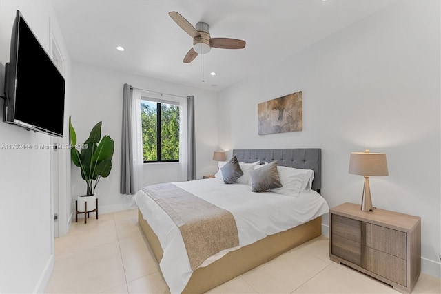 tiled bedroom featuring ceiling fan