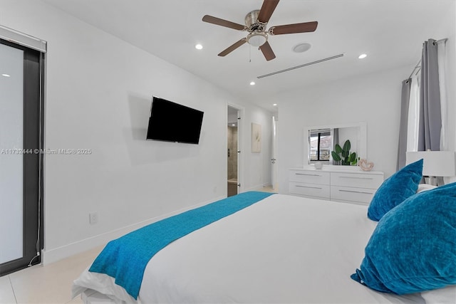 bedroom featuring ceiling fan and ensuite bath