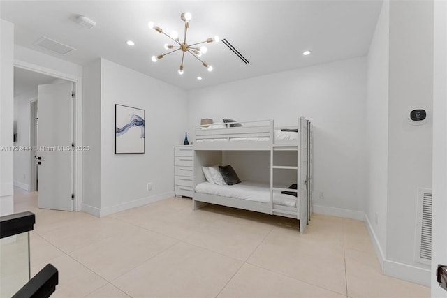 tiled bedroom with a chandelier