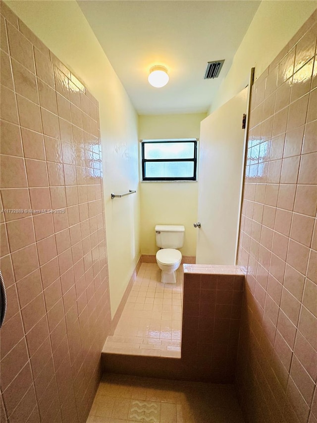 bathroom featuring tile patterned floors and toilet