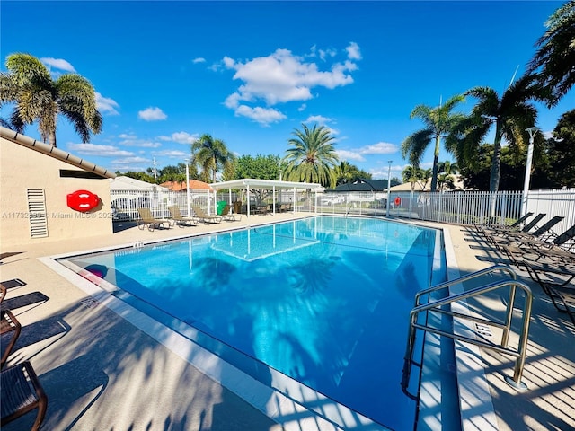 view of swimming pool with a patio