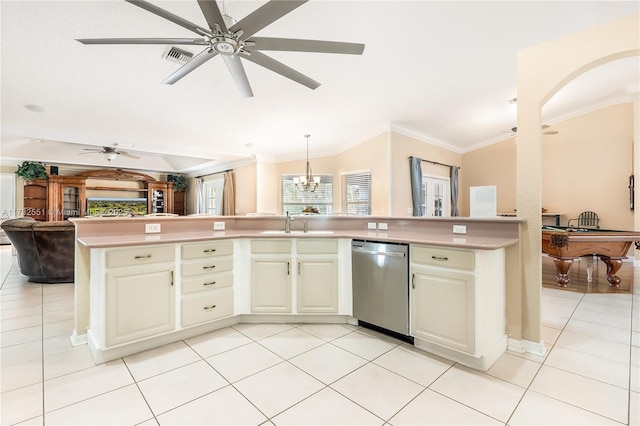 kitchen with light tile patterned floors, a sink, open floor plan, light countertops, and dishwasher