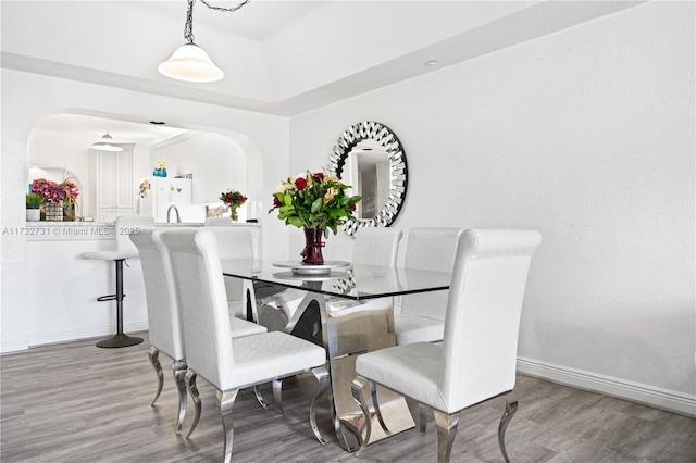 dining space featuring hardwood / wood-style flooring