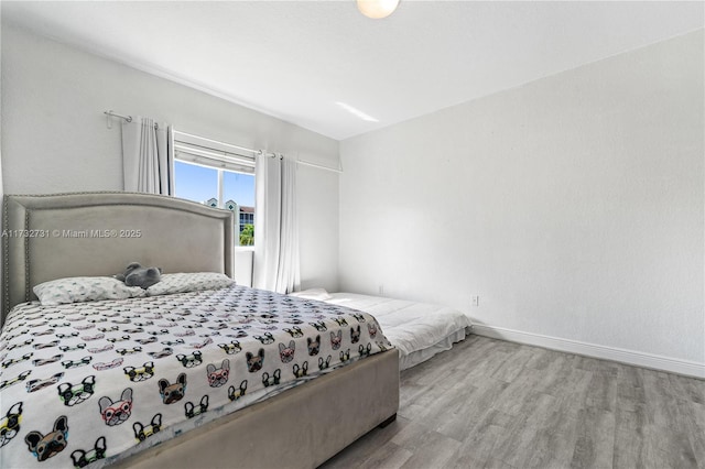 bedroom with light hardwood / wood-style flooring